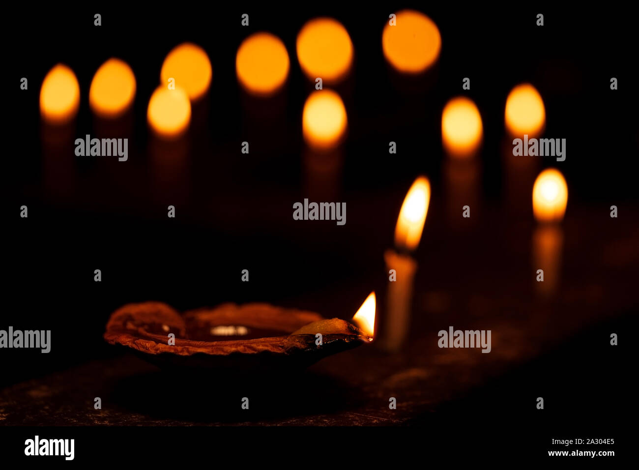 Diwali Diya oil lamp & Candles lit during diwali festival in India with