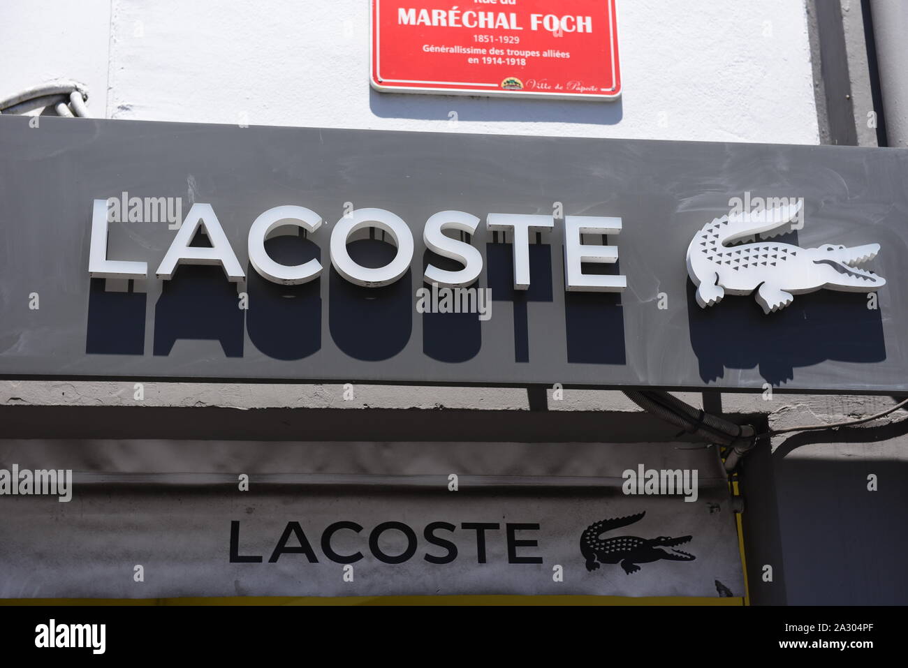 The Lacoste logo seen at a Lacoste Store in Papeete. Stock Photo