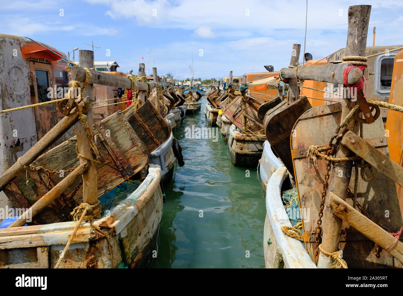 Sri Lanka Kalpitiya fishery harbour fishing vessels, view to ship rudders Stock Photo