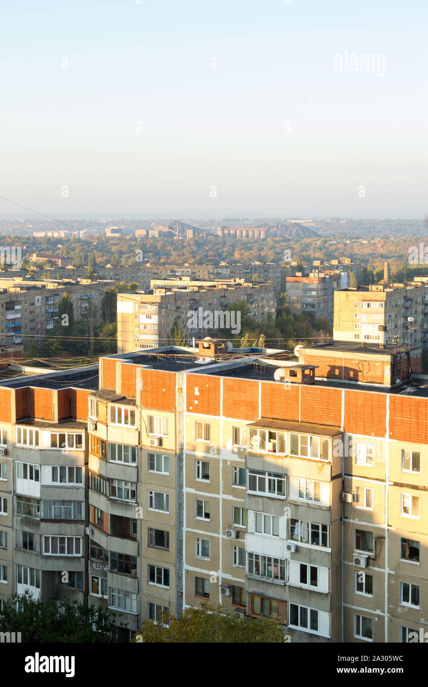 Donetsk, Ukraine, October 3, 2019 year. Old high-rise buildings in the residential area of Budennovsky district. Aerial view of sleeping quarter in Stock Photo