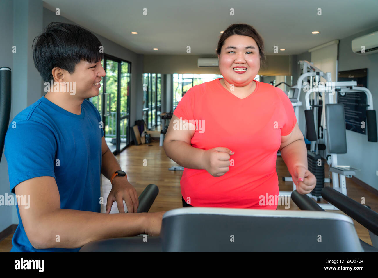 Personal trainer, team portrait or happy people at gym for a workout,  exercise or training for healthy fitness. Sports coaches, black woman or  Stock Photo - Alamy