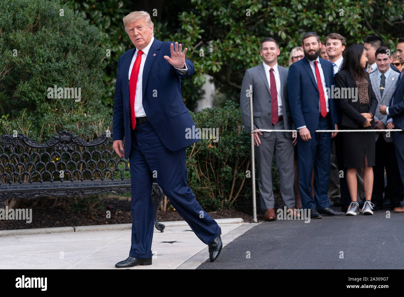 United States President Donald J. Trump waves to the media as he returns to the White House in Washington, DC after signing an executive order in The Villages, Florida 'Protecting and Improving Medicare' for senior citizens on Thursday, October 3, 2019.Credit: Chris Kleponis/Pool via CNP /MediaPunch Stock Photo