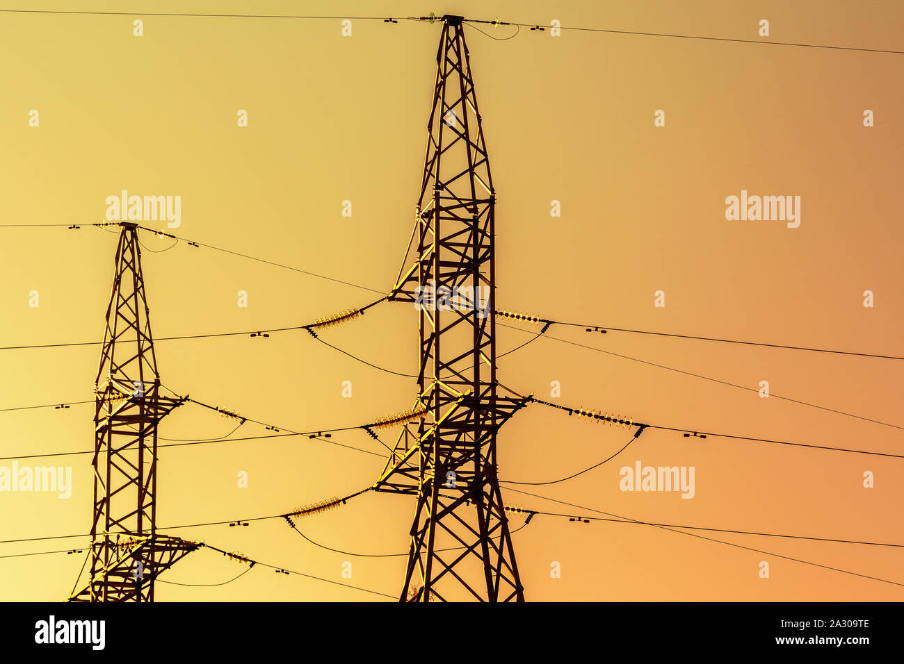 Silhouettes of High voltage electric towers on the sunset time Stock ...