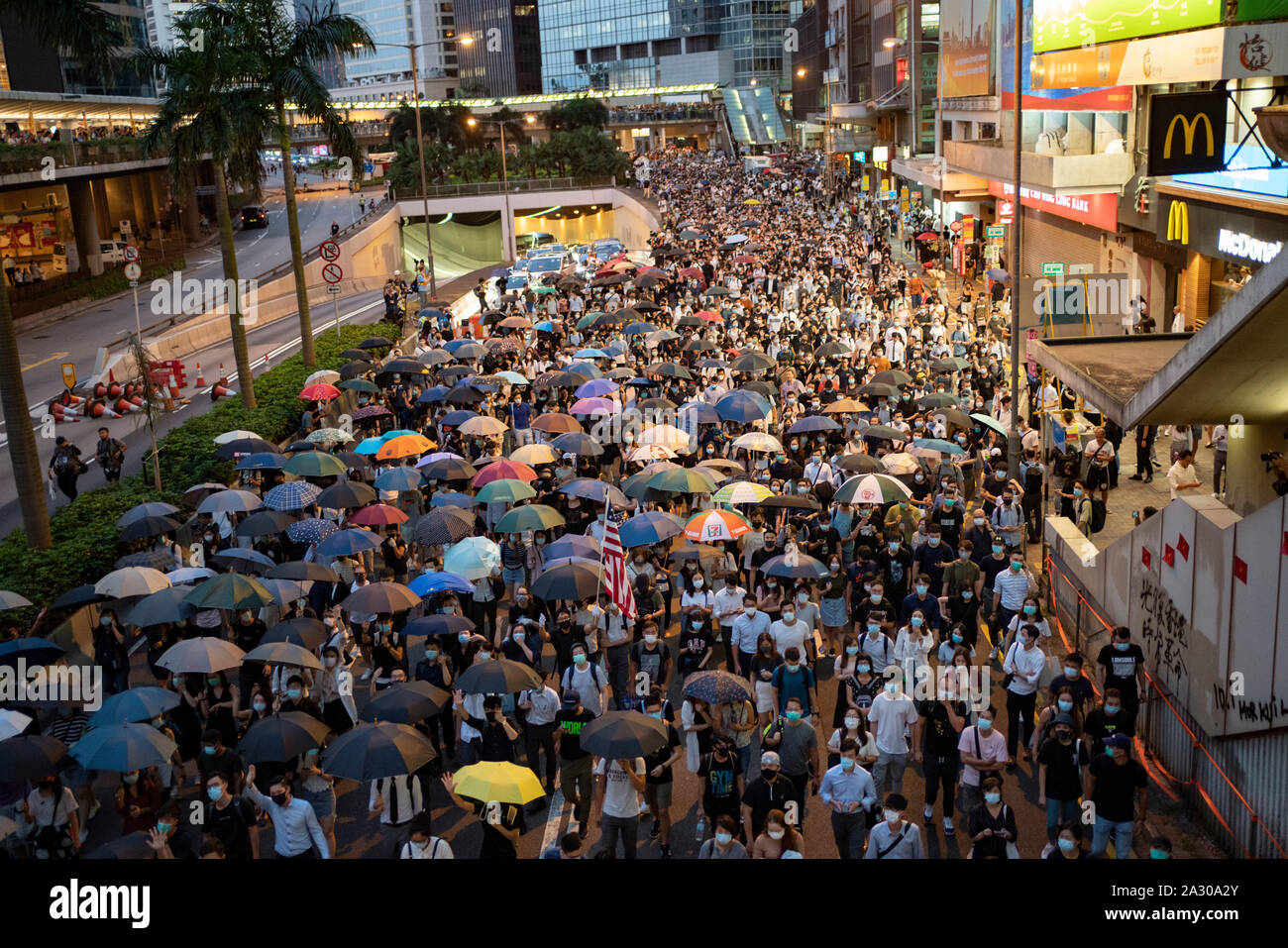 Hong Kong. 4 October 2019. Large gathering of pro- democracy supporters evening in Hong Kong Central District. Protestors angry with Chief Executive Carrie Lam's use of Emergency Powers to ban the wearing of masks during protests. March proceeded peacefully towards Wanchai district.  Iain Masterton/Alamy Live News. Stock Photo