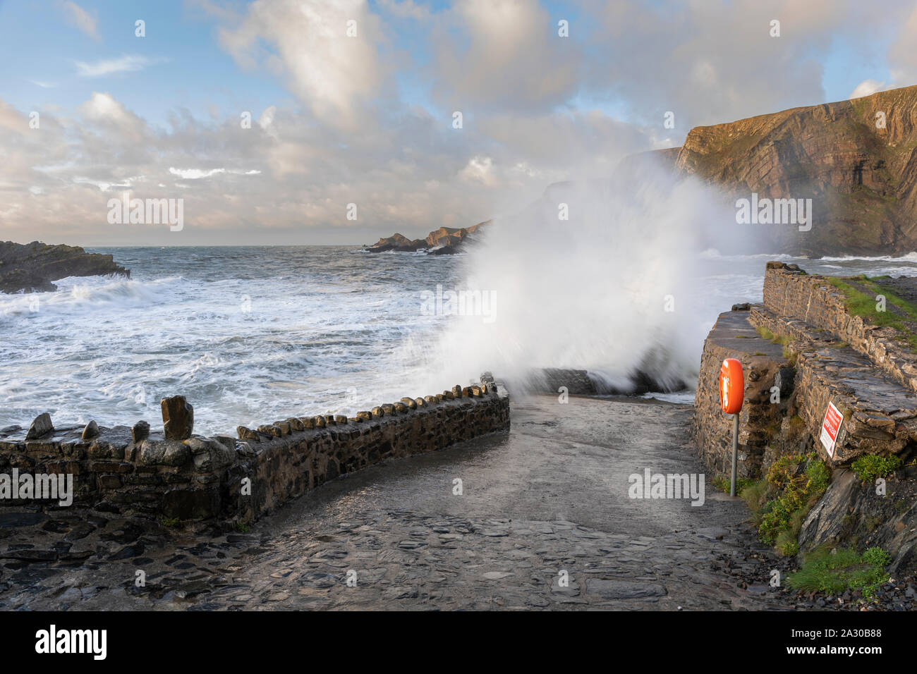 huge waves crash at Hartland on the north Devon coast during stormy weather. Stock Photo