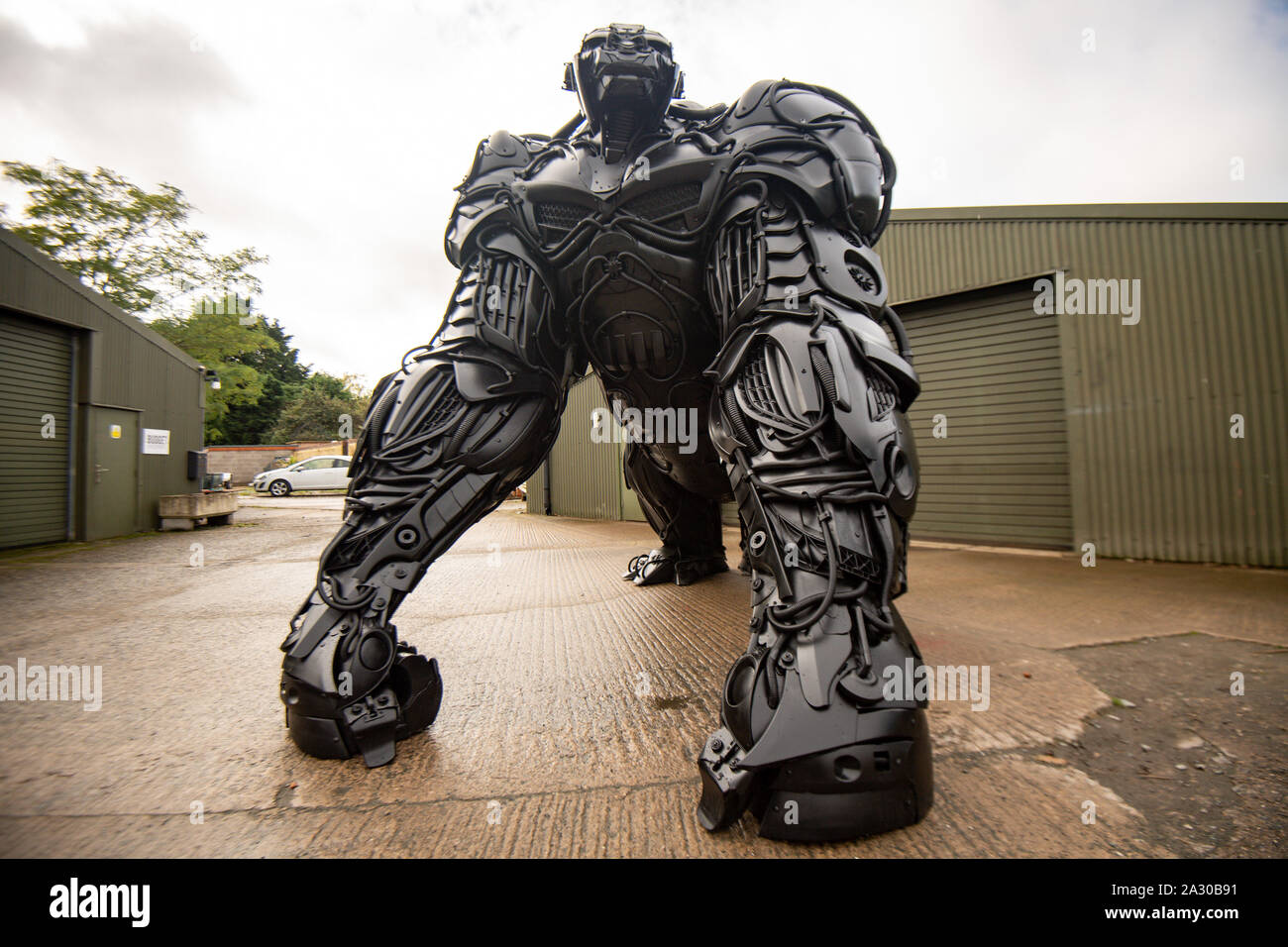 A 12ft sculpture of a gorilla, entitled 'Gorilla Apocalypse', created by Luke Kite entirely from scrap car bumpers and panels discarded from only the last decade, on display at the British Ironwork Centre in Oswestry, Shropshire. Stock Photo
