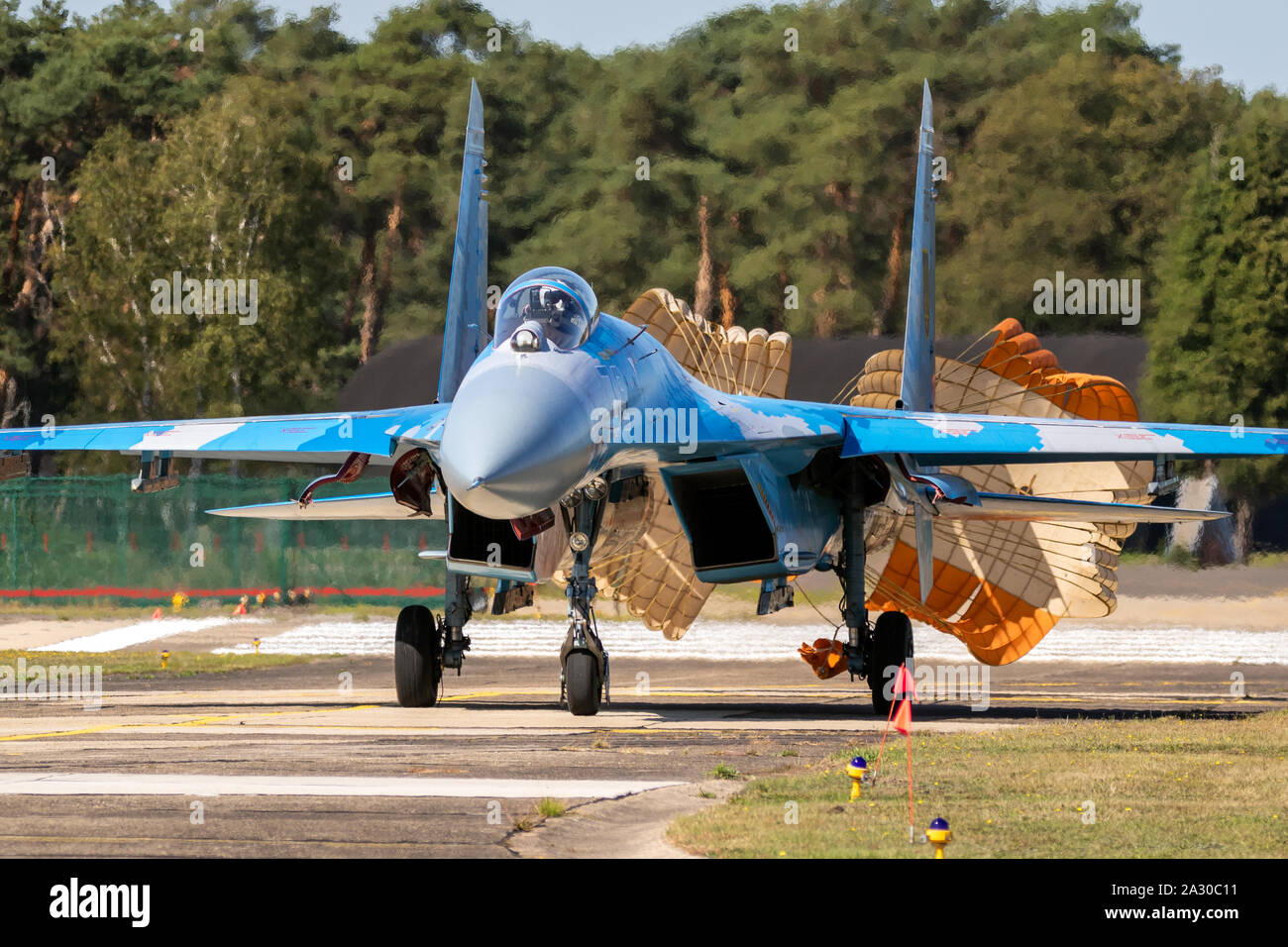 KLEINE BROGEL, BELGIUM - SEP 14, 2019: Ukrainian Air Force Sukhoi Su-27 Flanker fighter jet aircraft taxiing with parachute after landing on Kleine-Br Stock Photo