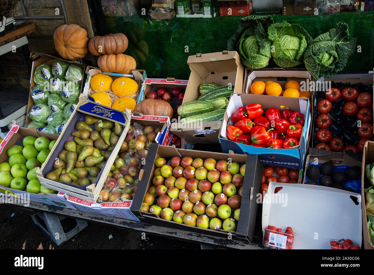 Fruit and vegetables on display outside a greengrocer's shop in Holmfirth, West Yorkshire Stock Photo