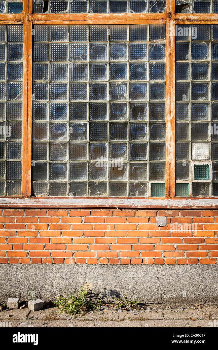 Red brick wall with glass block window. Architecture detail Stock Photo ...