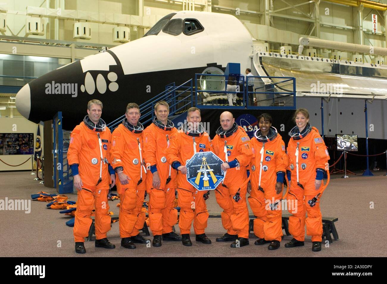 Houston, Texas, USA. 21st Mar, 2006. FILE: In this photo released by NASA, The crew members assigned to STS-121 take a break from training for a group shot in the Johnson Space Center's Space Vehicle Mockup Facility in Houston, Texas on March 21, 2006. From the left are astronauts Thomas Reiter of the European Space Agency, Michael E. Fossum, Piers J. Sellers, Steven W. Lindsey, Mark E. Kelly, Stephanie D. Wilson and Lisa M. Nowak. Lindsey is mission commander and Kelly is pilot, with the other five serving as mission specialists. Once onboard the International Space Station, Reiter, who flew Stock Photo