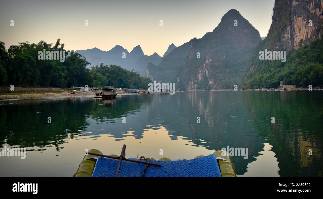 Li river basin and mountains at dusk from boat, Guangxi, China Stock Photo