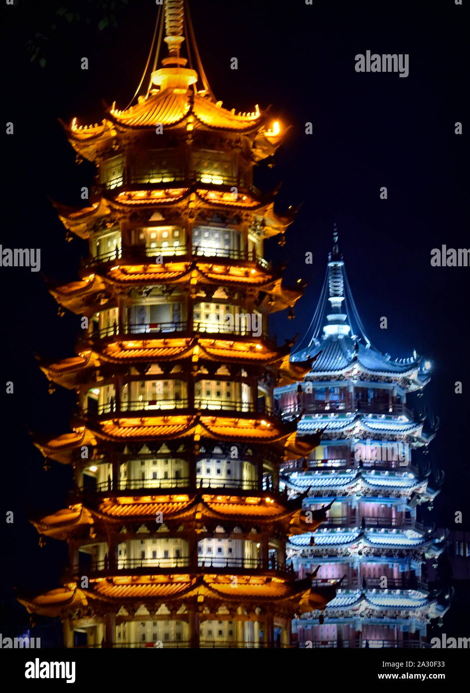 Beautiful Sun and Moon pagodas of Guilin at night, China Stock Photo