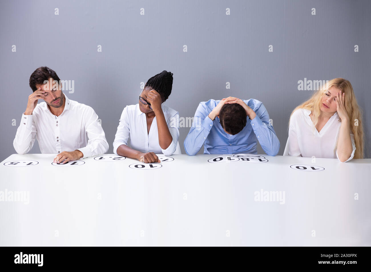 Tired Stressful Multiracial Judges Sitting On Chair With Scoring Point 
