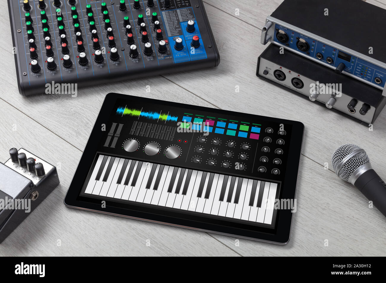 Piano synthesizer app on tablet and musical instrument concept Stock