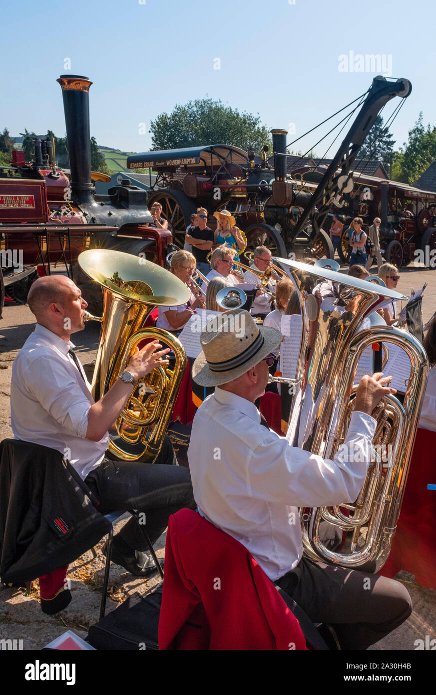 A silver band playing surrounded by steam engines at Bishops Castle Michaelmas Fair, Shropshire, England, UK Stock Photo
