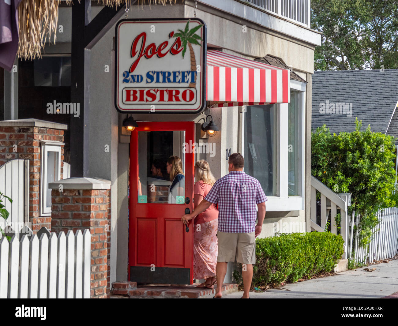 People entering restaurant in Fernandina Beach on Amelia Island Florida Stock Photo