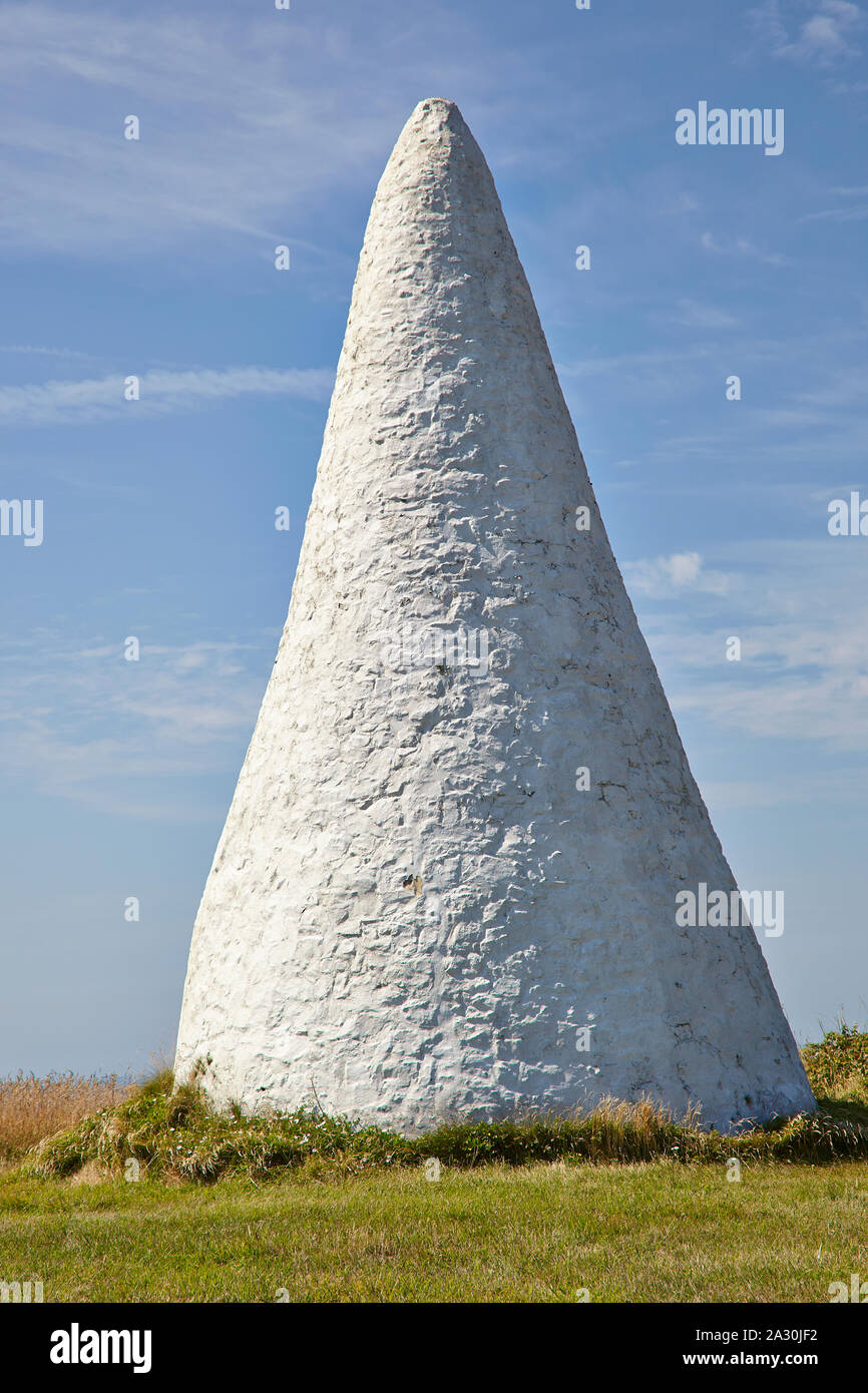 White painted conical shaped stone landmark at Fort Tougis, Alderney, Channel Islands Stock Photo