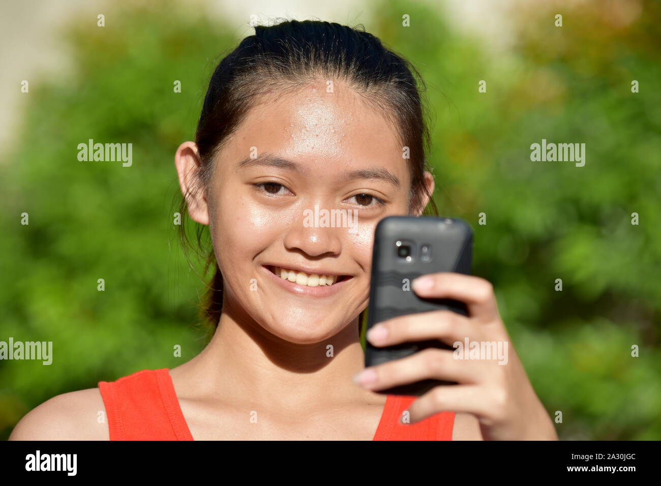 Selfy Of Beautiful Asian Female With Cellular Phone Stock Photo