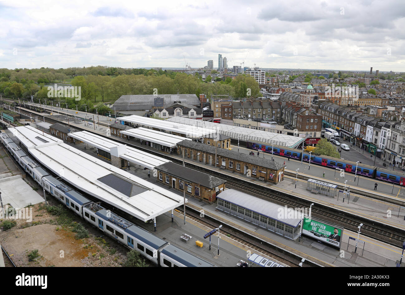 High level view of Finsbury Park station, north London, UK. Shows Thameslink and Great Northern trains. New tower blocks in Tottenham on the horrizon. Stock Photo
