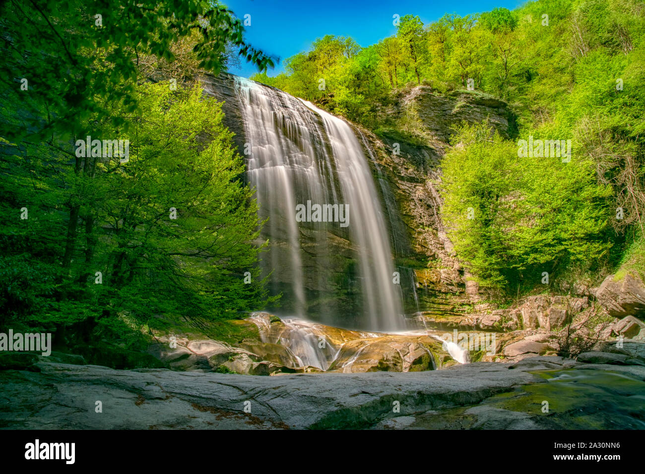 Suuctu waterfalls in Mustafa Kemal Pasa, Bursa, Turkey. Beautiful waterfall among trees, green leaves, rocks and stones in hidden forest with river ba Stock Photo