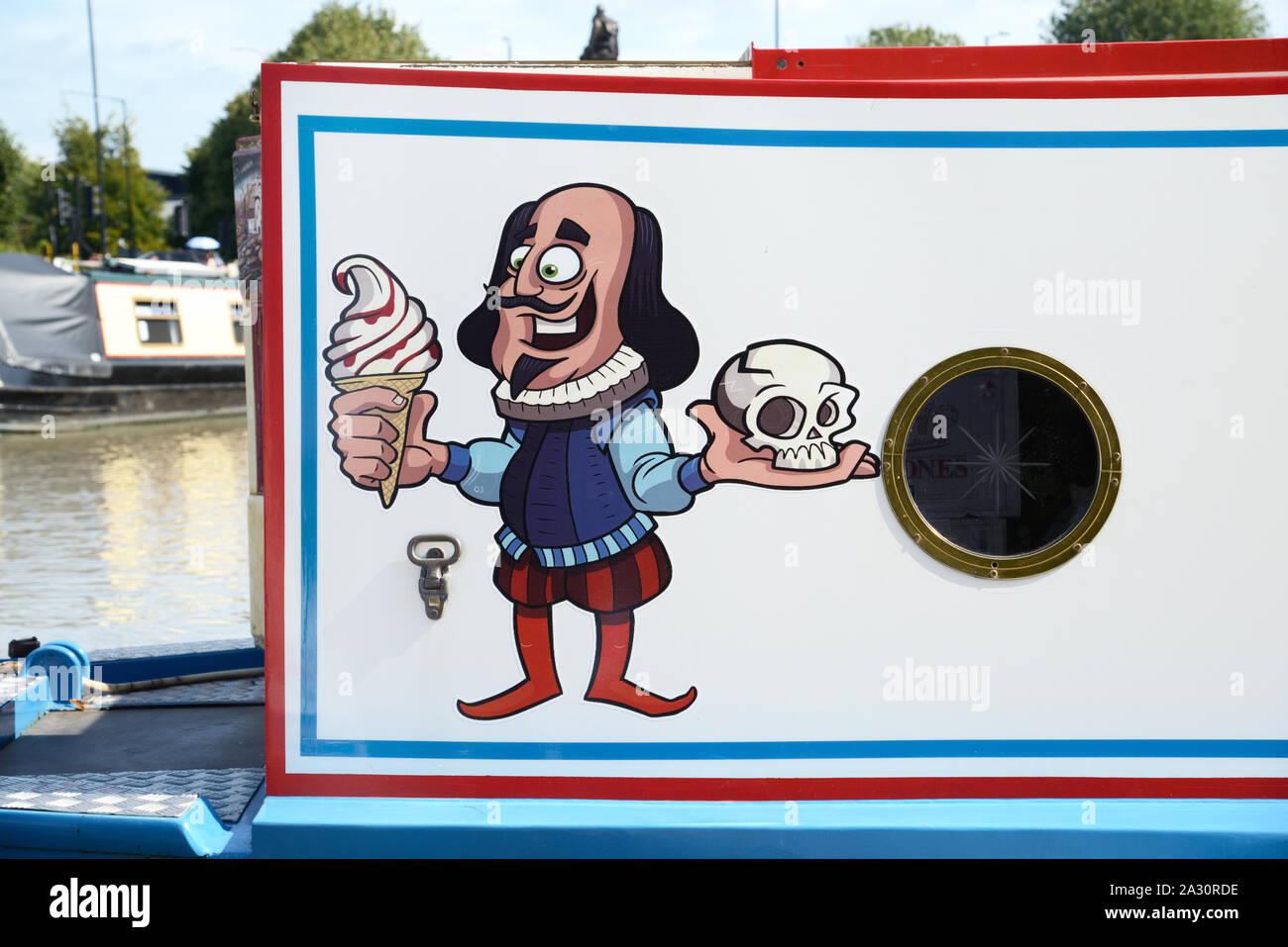 Caricature of William Shakespeare Holding Yorick's Skull, from Hamlet, & Ice Cream on Ice Cream Barge or Canal Boat Stratford-upon-Avon Stock Photo