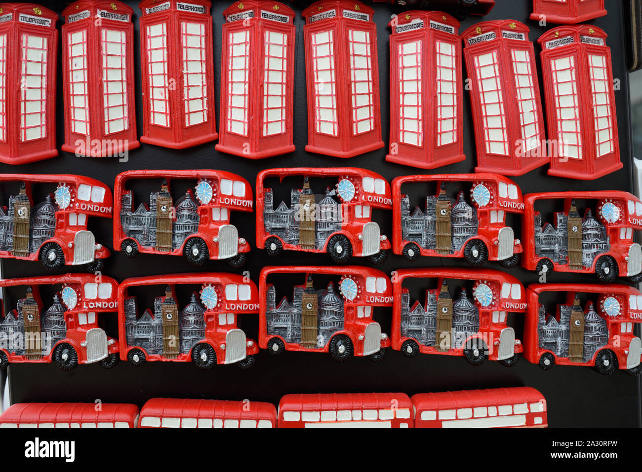 Red Buses & Red Telephone Boxes Souvenir Fridge Magnets on Sale in Gift Shop or Souvenir Stall London UK Stock Photo