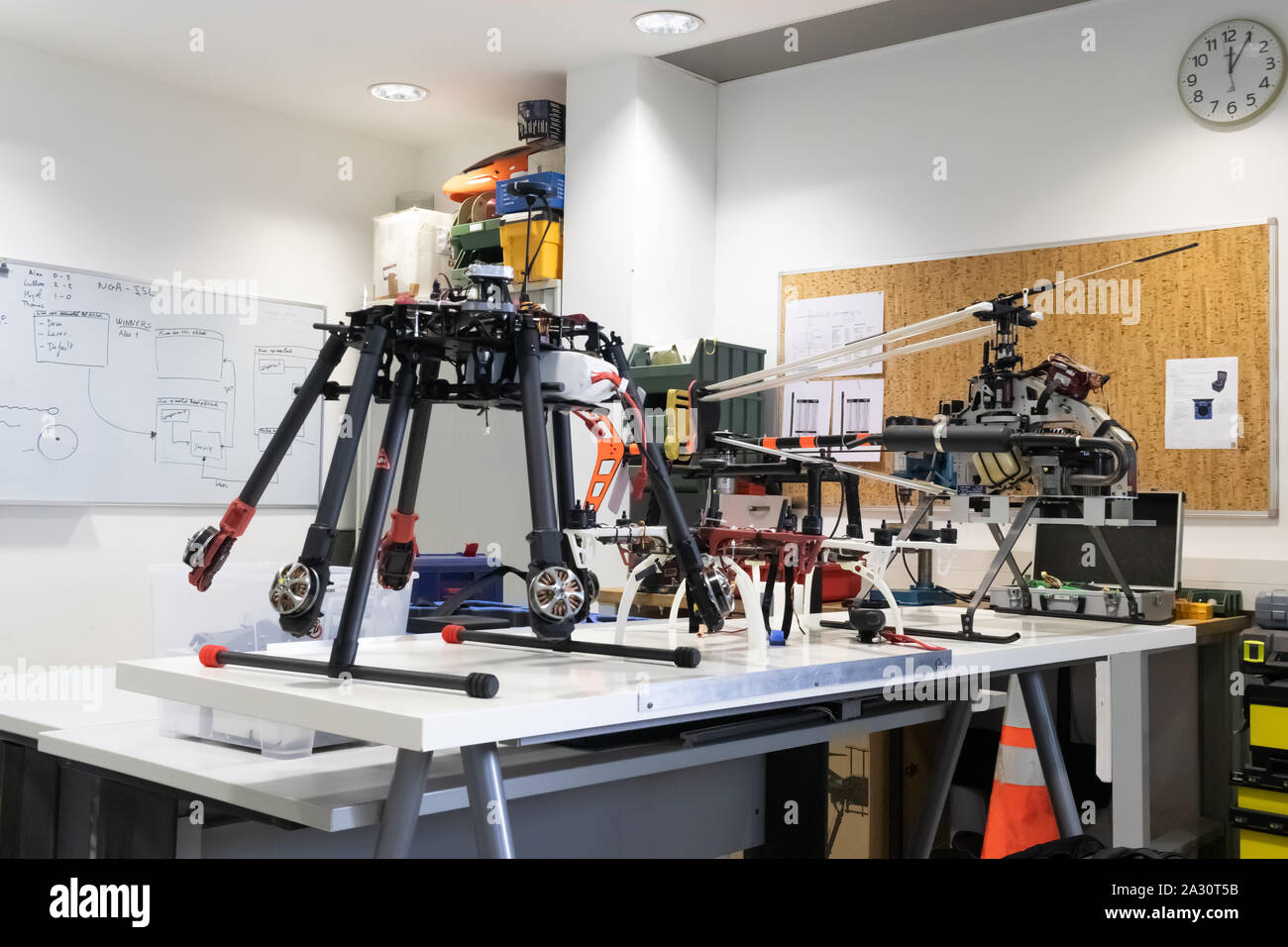 Research and development drone laboratory. View of an indoor workshop with multiple kinds of UAV Stock Photo