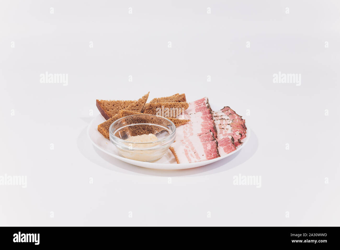 Sliced pork lard. Sliced bacon. Fat, tallow grease bacon isolate white