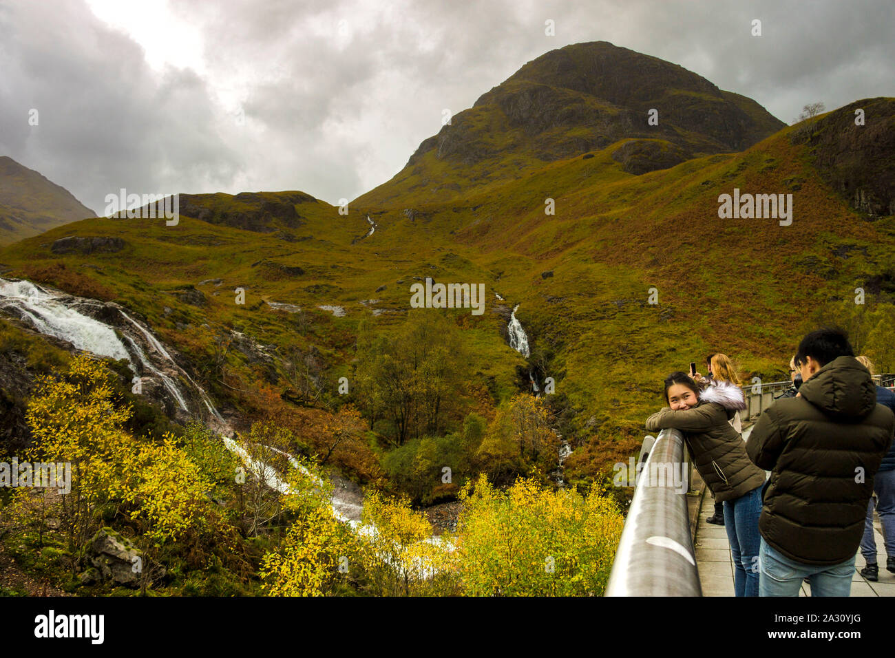 Tourists in Glencoe, Scottish Highlands. Stock Photo