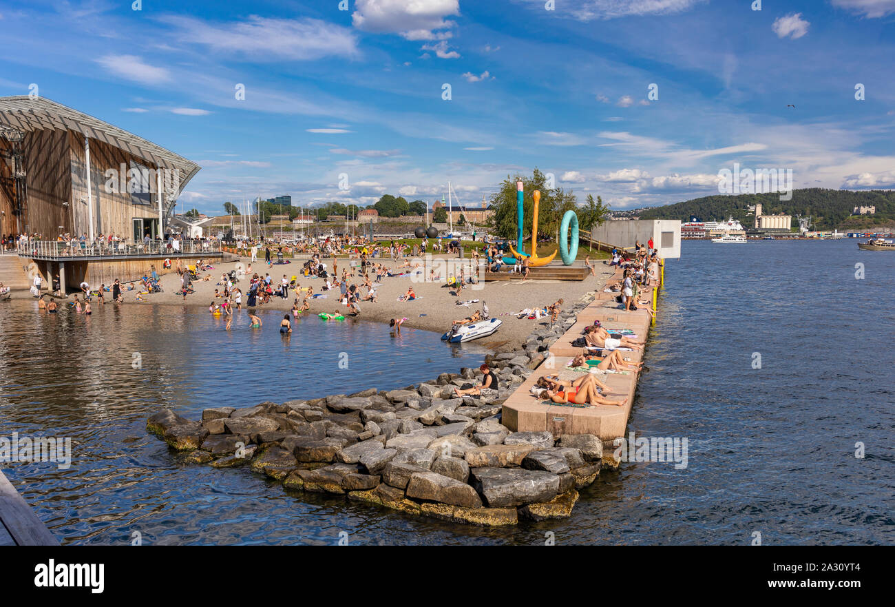 OSLO, NORWAY - People sunbathing and swimming at Filipstad, Oslo waterfront. Stock Photo