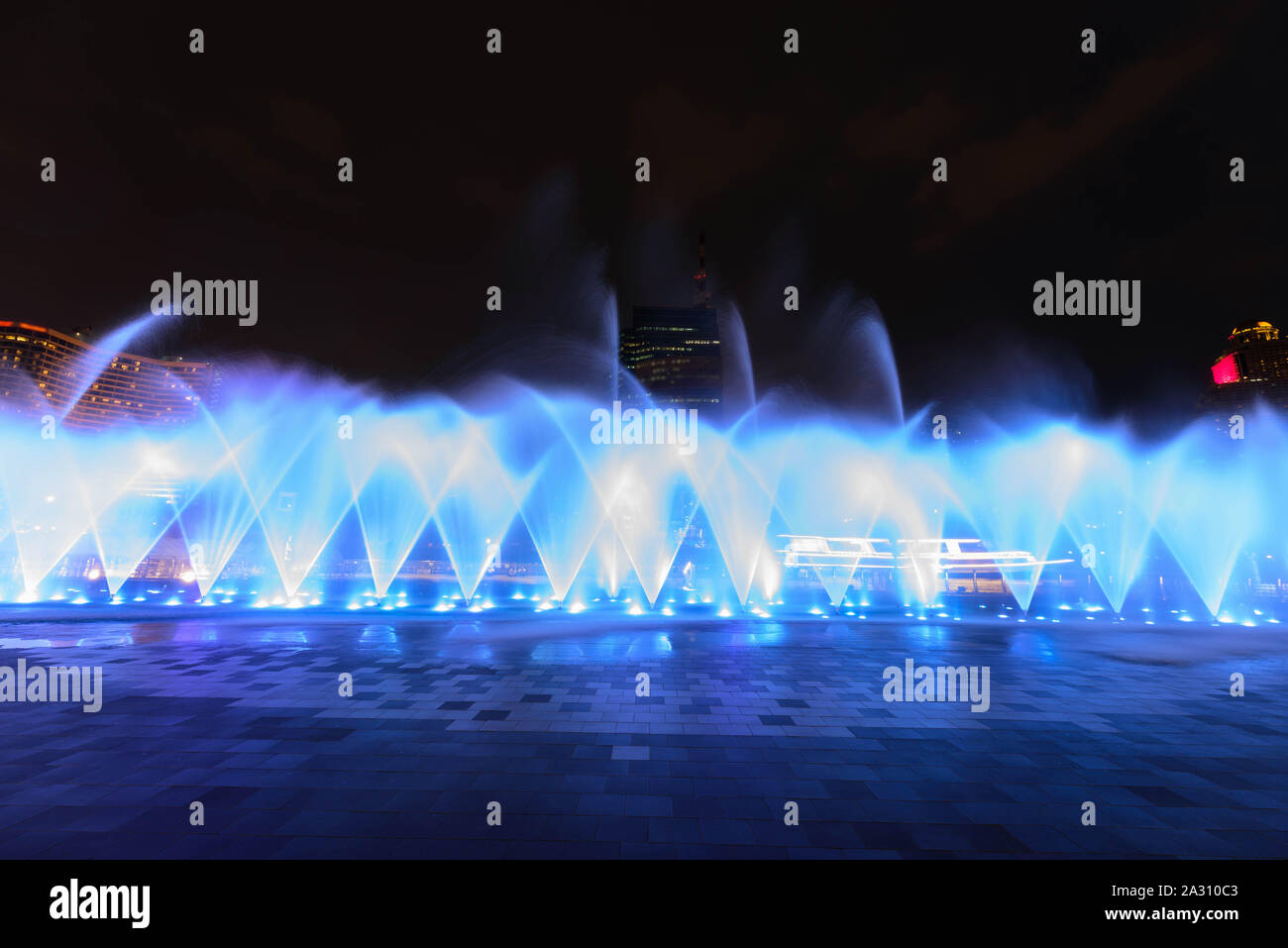 the fountain showing with lighting in night time Stock Photo - Alamy