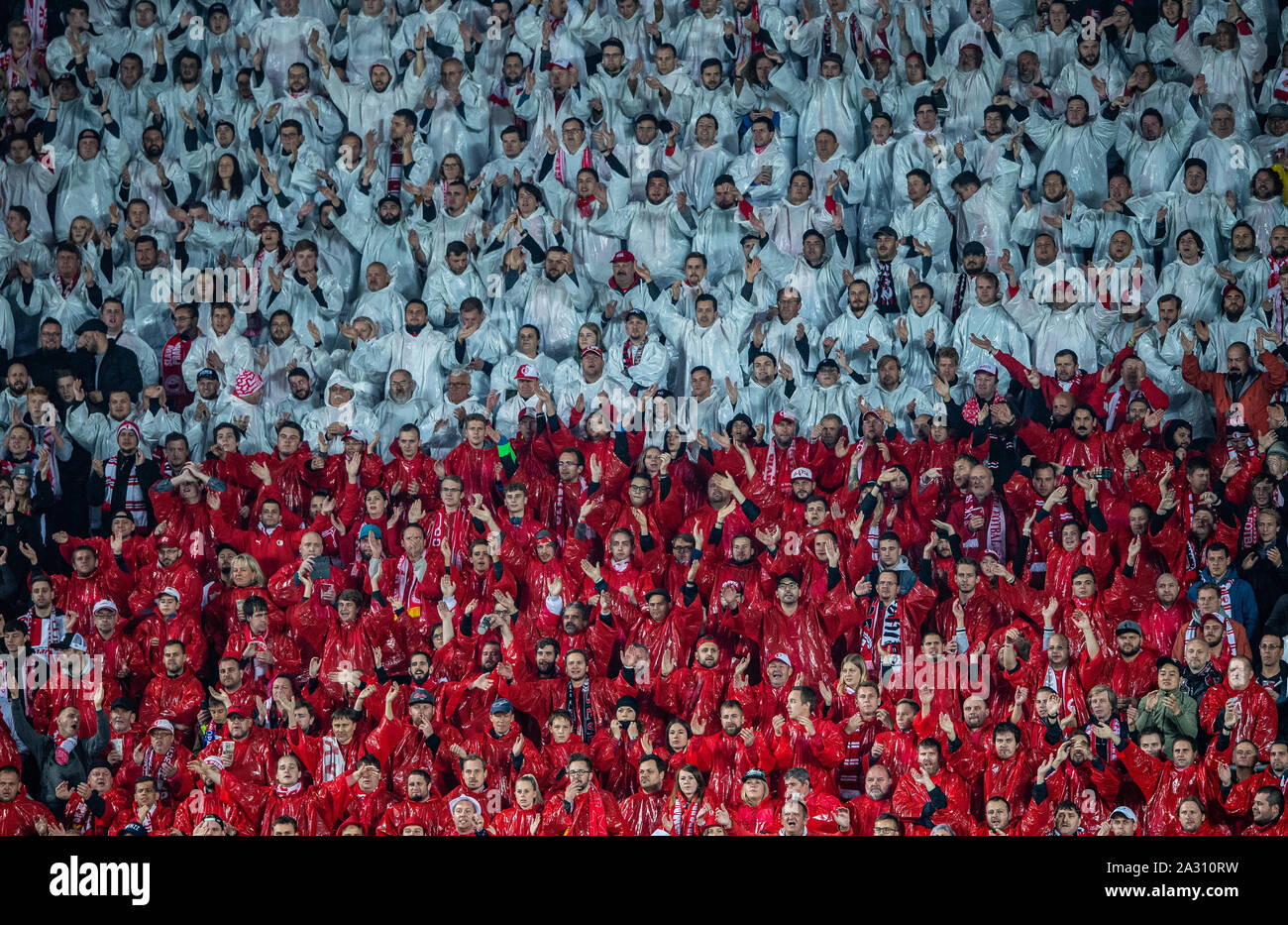 Prag, Czechia. 02nd Oct, 2019. Soccer: Champions League, Slavia Prague - Borussia Dortmund, Group stage, Group F, 2nd matchday at Sinobo Stadium. The fans of Slavia Prague are in the fan curve with red and white rainwear. Credit: Guido Kirchner/dpa/Alamy Live News Stock Photo