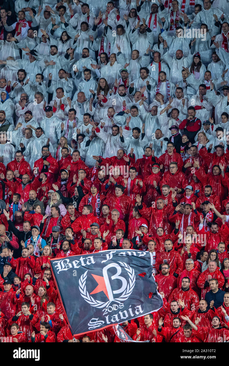 Prag, Czechia. 02nd Oct, 2019. Soccer: Champions League, Slavia Prague - Borussia Dortmund, Group stage, Group F, 2nd matchday at Sinobo Stadium. The fans of Slavia Prague are in the fan curve with red and white rainwear. Credit: Guido Kirchner/dpa/Alamy Live News Stock Photo