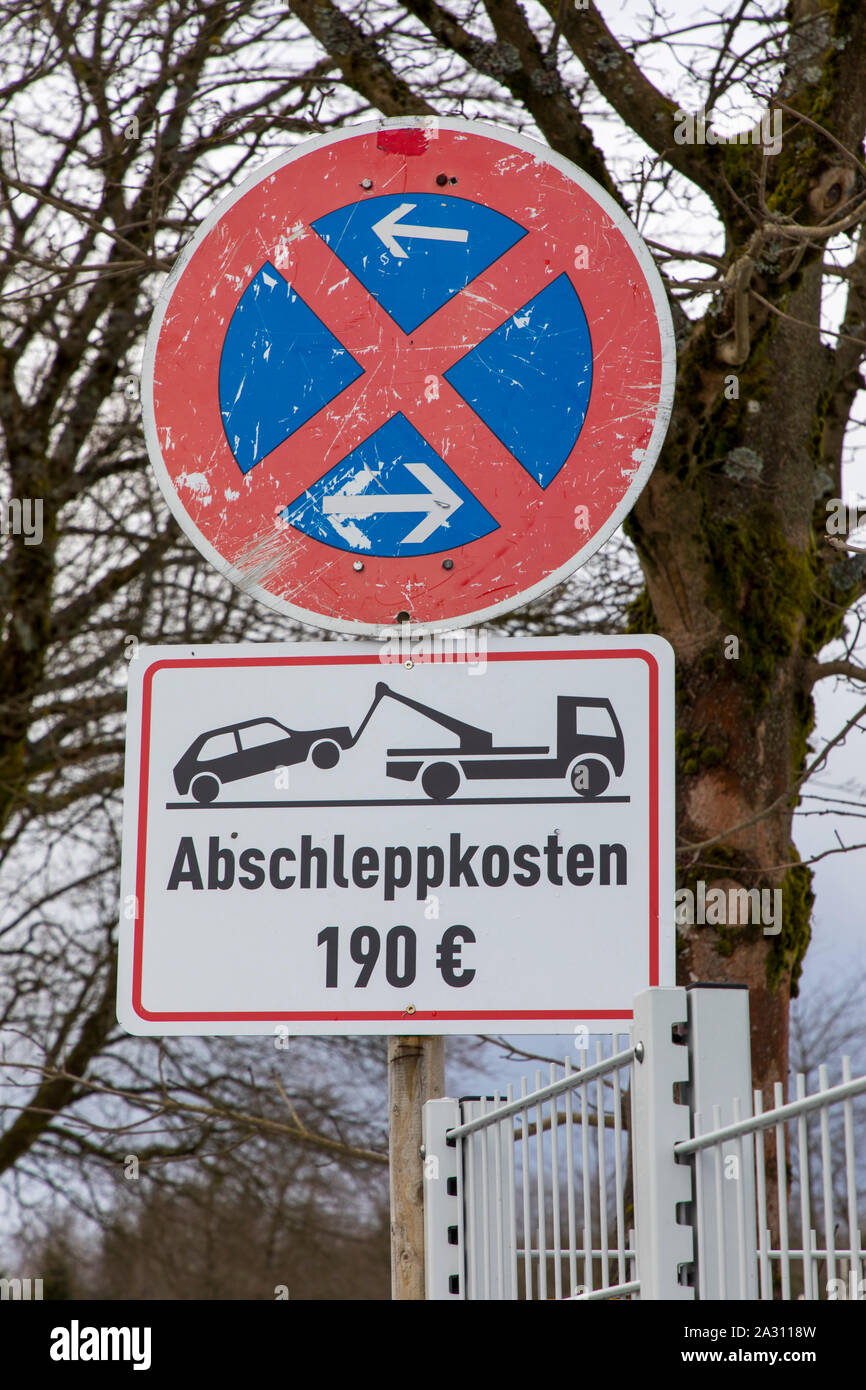 No stopping sign and warning of towing costs, in Winterberg, Sauerland, Germany Stock Photo