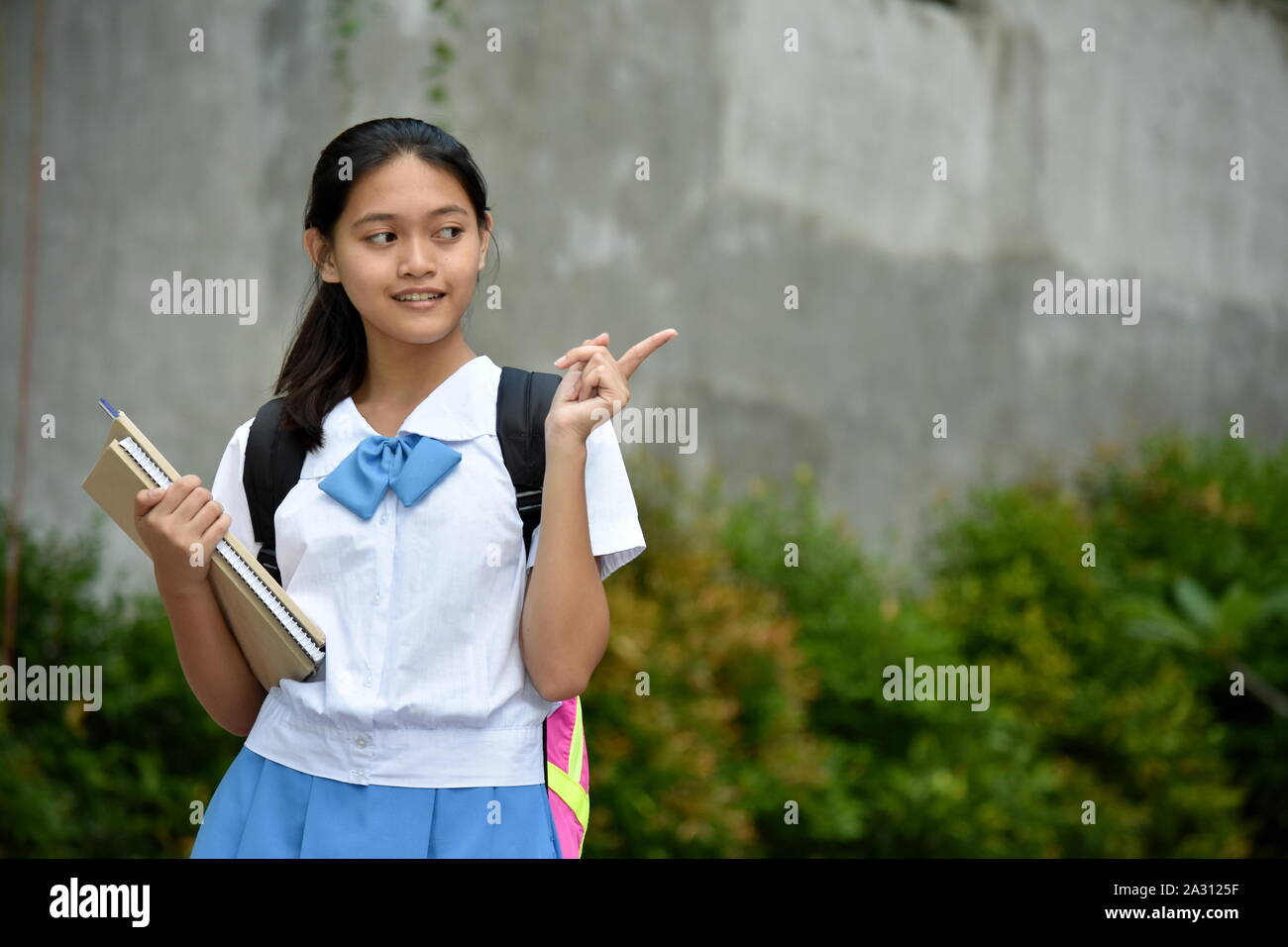 A Girl Student Pointing Stock Photo