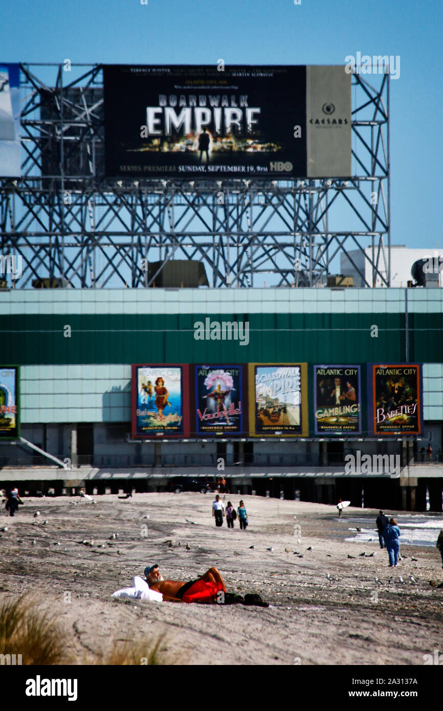 Huge posters advertising the HBO series 'Boardwalk Empire' dominate the boardwalk  in Atlantic City in this image from October 2010. The city is in trouble after three casinos have closed in rapid succession, the latest being The Revel Resort. Stock Photo