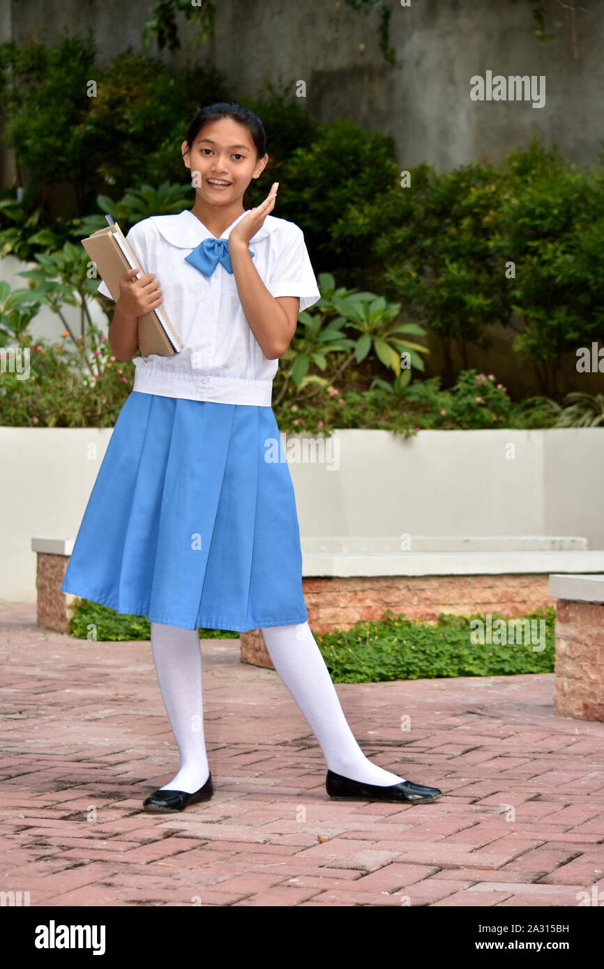 Surprised Young Female Student With School Books Stock Photo - Alamy