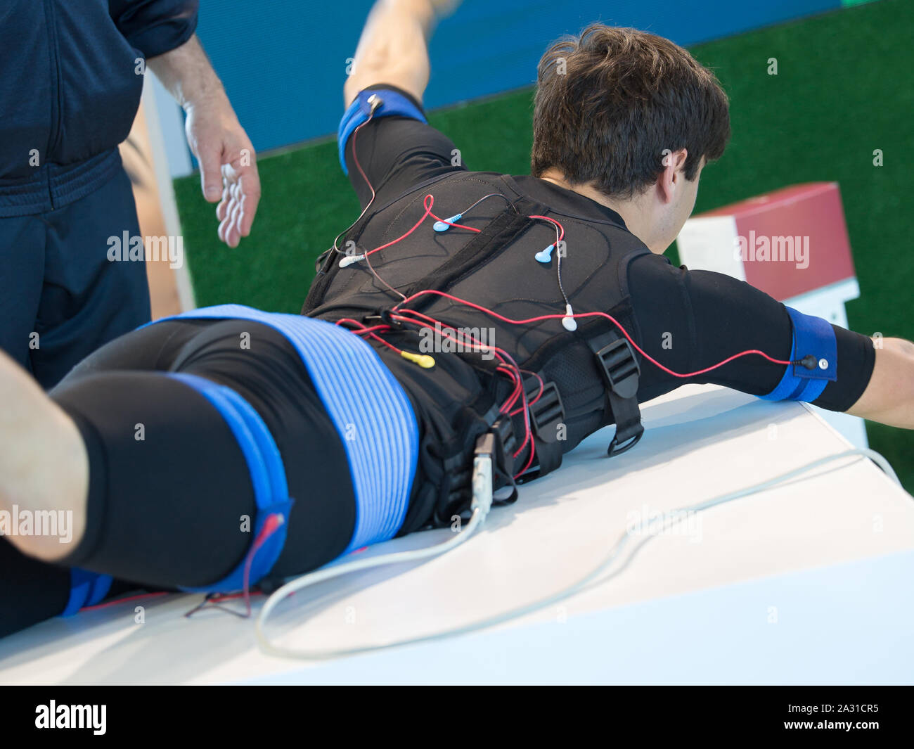 Boy Wearing Black Jacket with Electrode Muscular Electrostimulation