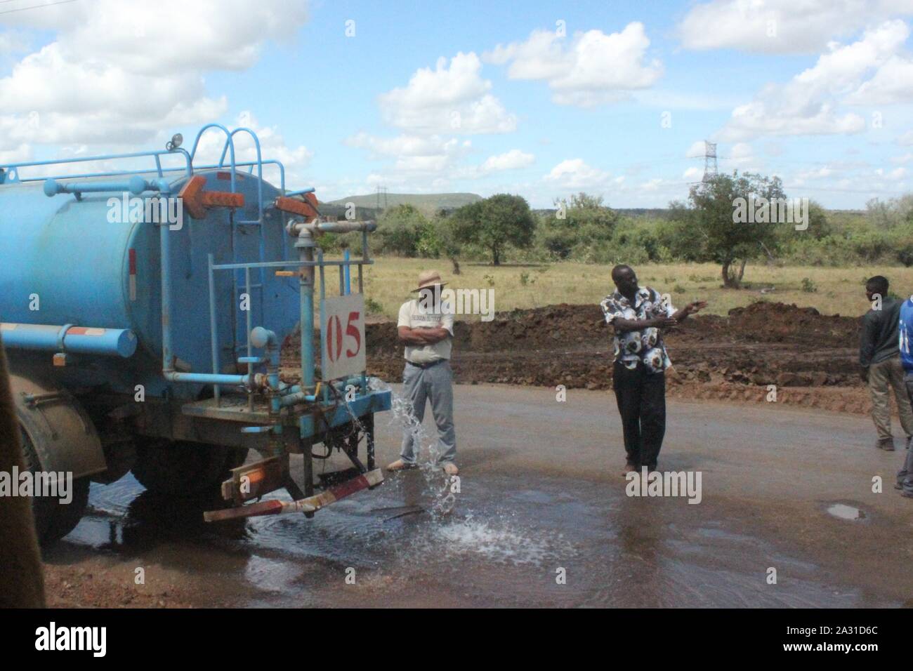 Mombasa Road in Kenya, Summer 2015 (km 68):  Water tanker truck loosing water in the Samburu area Stock Photo