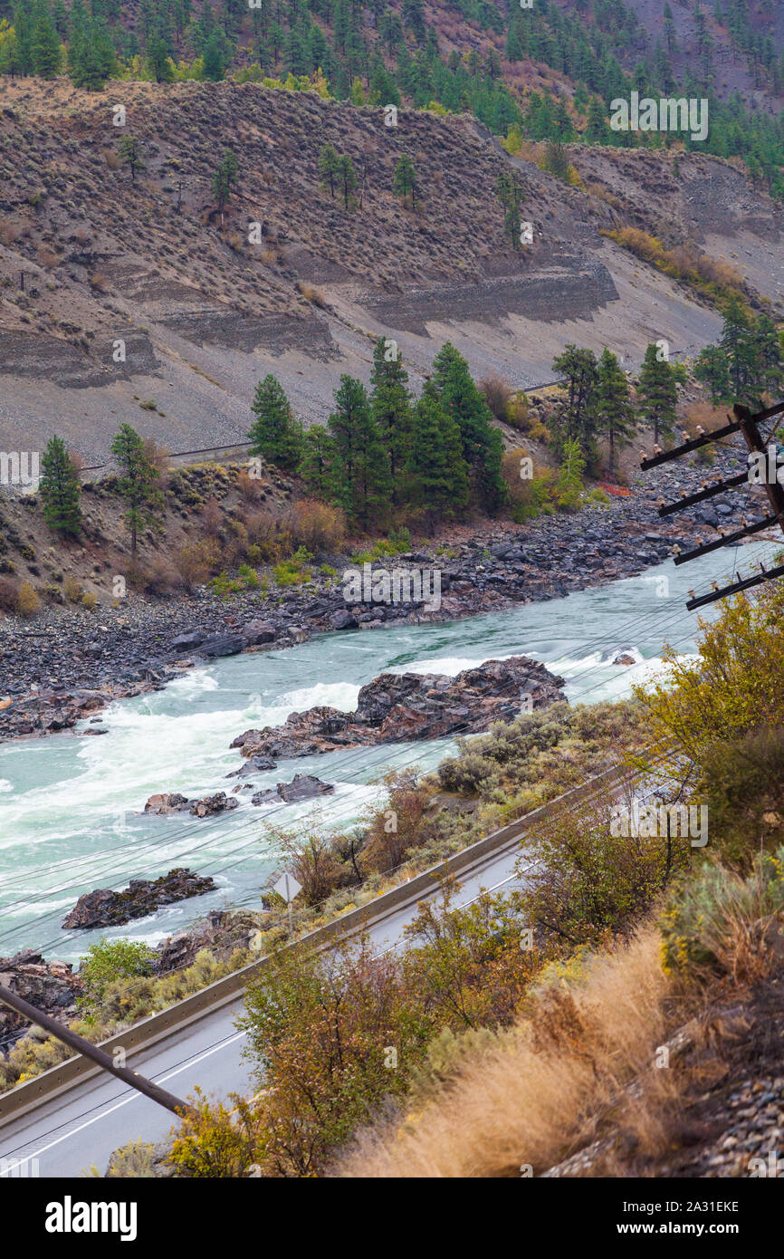 Canadian National railway track, the Thompson River, and the Trans-Canada Highway seen from the Rocky Mountaineer tourist train in British Columbia Stock Photo