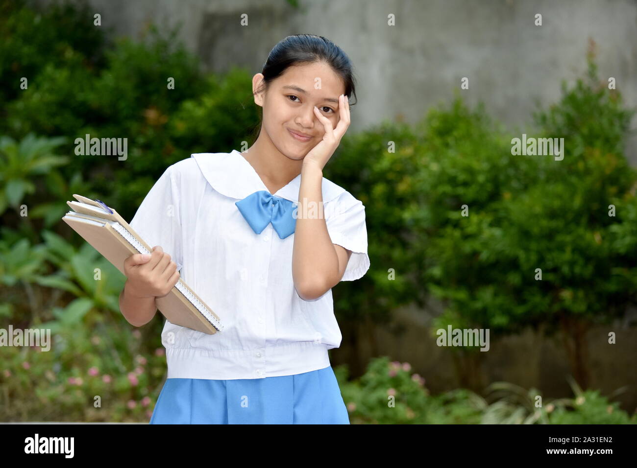 A Shy Pretty Filipina Person Stock Photo