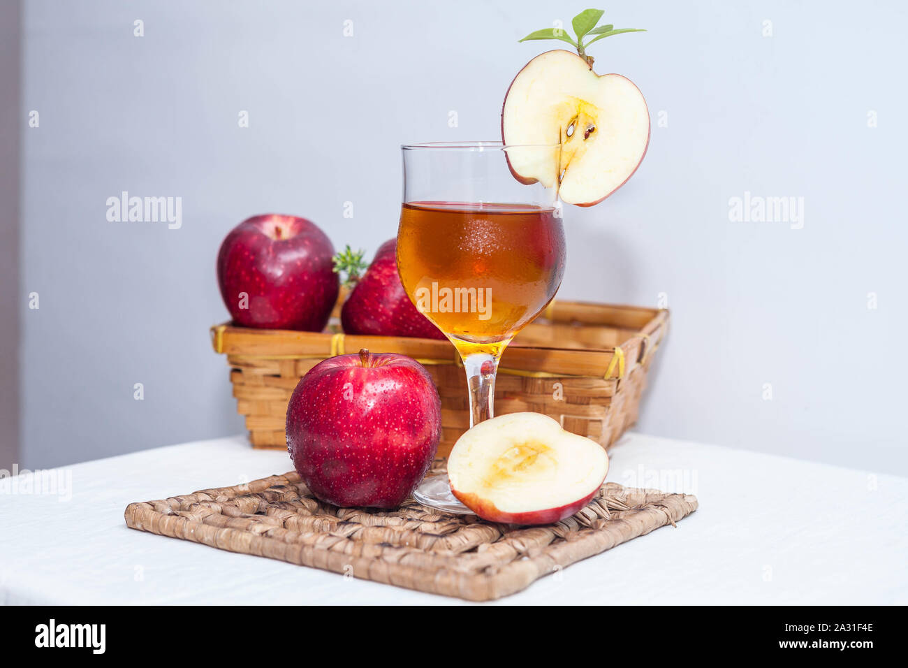 Apple juice is a fruit juice made by the maceration and pressing of an apple. Stock Photo