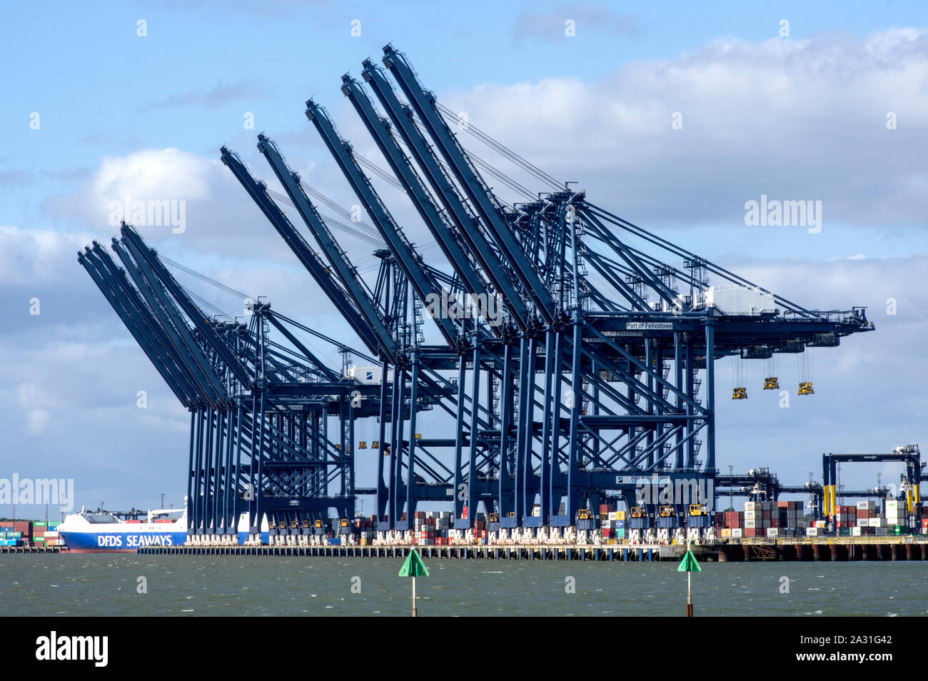 Container gantry cranes lined up readt to load ships Stock Photo