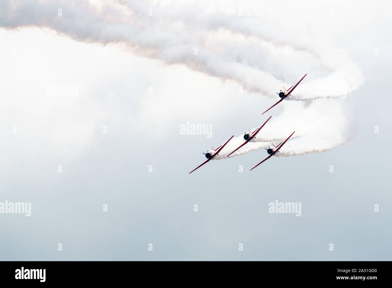 Planes performing acrobatic flight at air show. Stock Photo