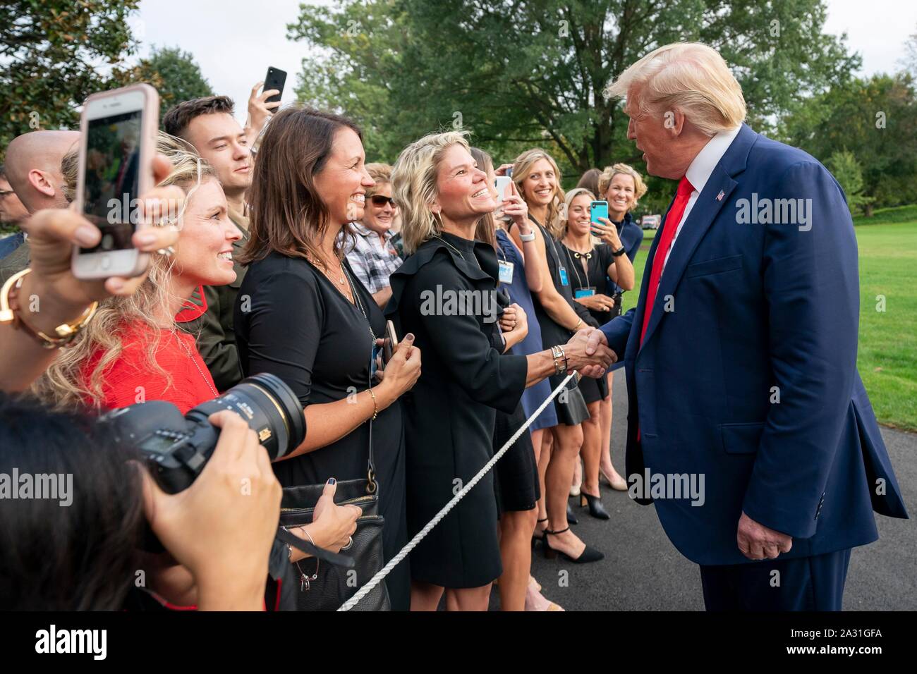 Washington, United States of America. 03 October, 2019. U.S President Donald Trump greets supporters on his return from a trip to Central Florida on the South Lawn of the White House October 3, 2019 in Washington, DC. Credit: Tia Dufour/White House Photo/Alamy Live News Stock Photo
