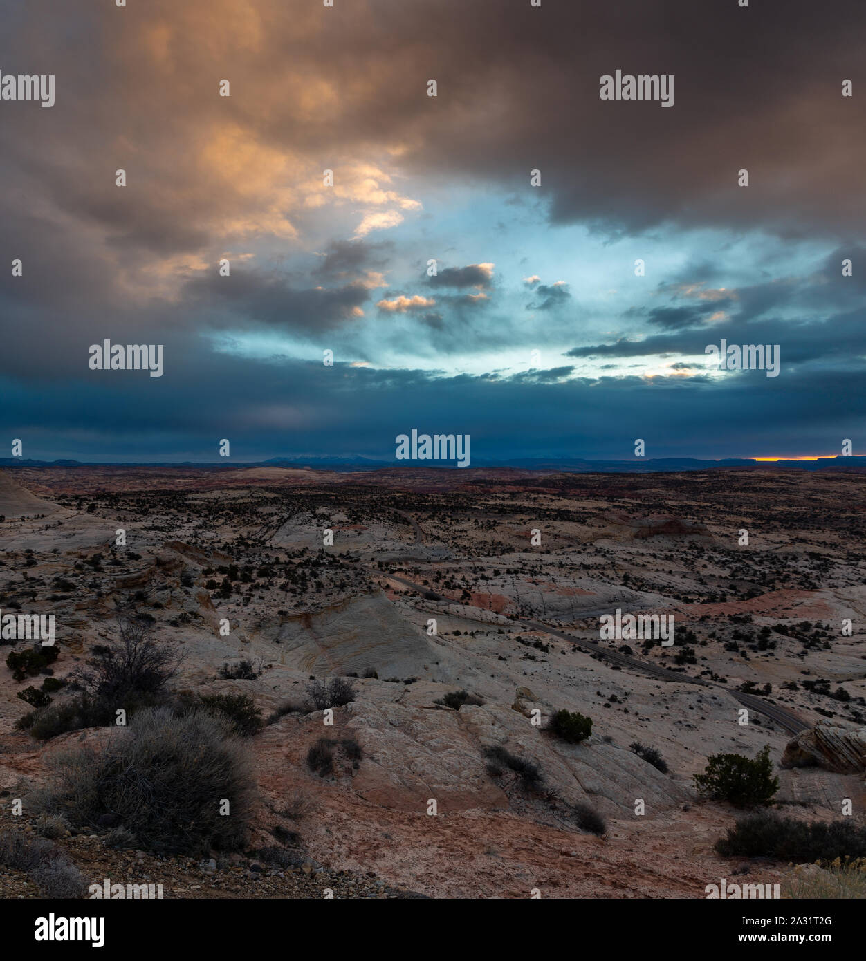 Stormy weather and clouds hovering over Highway 12 and sandstone dunes. Grand Staircase