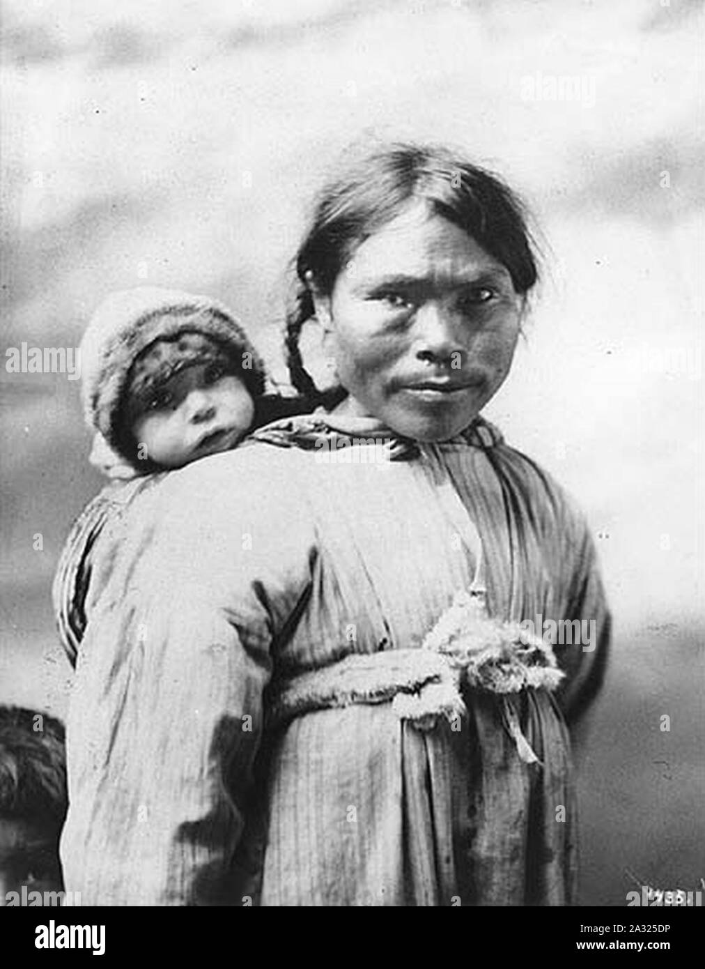 Eskimo mother with infant on her back Alaska ca 1901 (HEGG 690). 