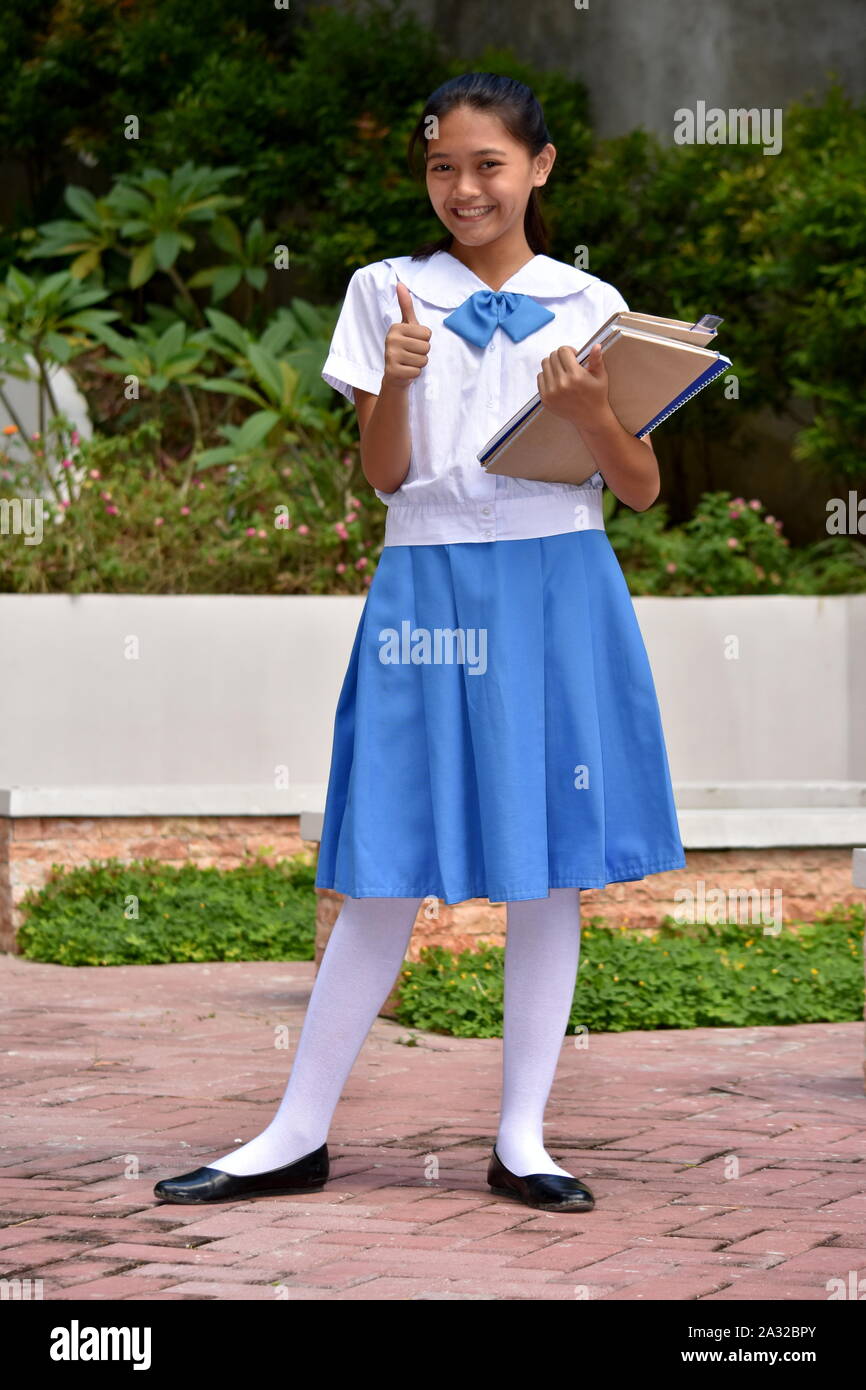 A Female Student With Thumbs Up Stock Photo - Alamy