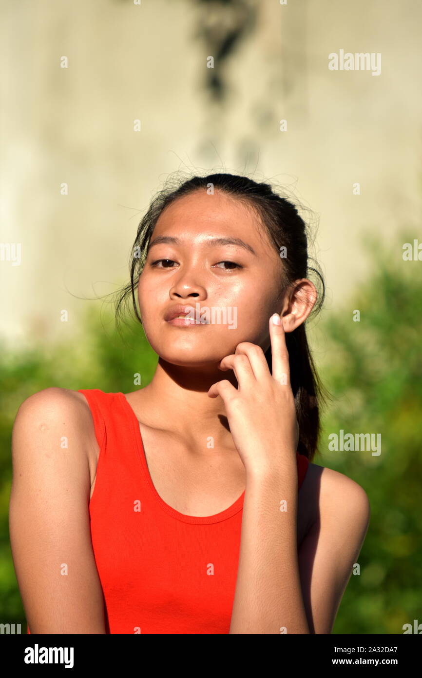 A Beautiful Minority Teenager Girl Thinking Stock Photo - Alamy