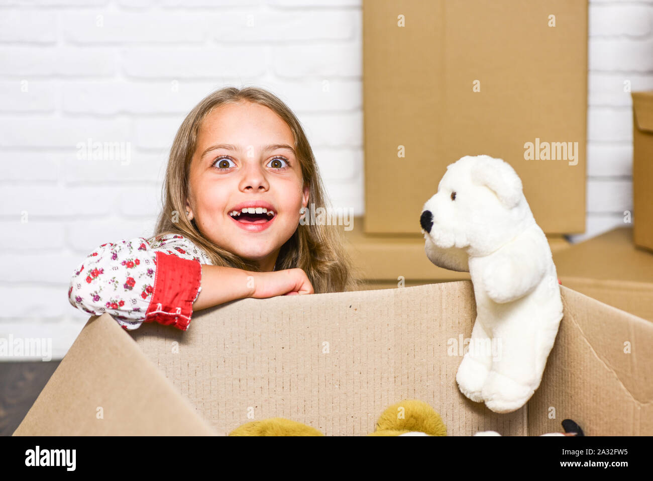 Experience the Lifestyle. happy little girl with toy. repair of room